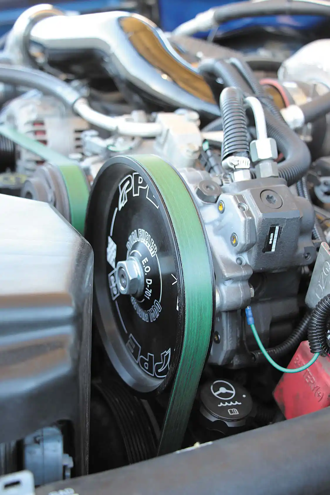 With 100 percent over injectors from Exergy Performance to feed, a PPE Dual Fueler CP3 kit was installed. Matt sourced both brand new pumps from his local <a href="https://www.gm.com/">GM</a> dealer. An LB7 CP3 sits in the factory location, with an LBZ pump getting belt driven up top.