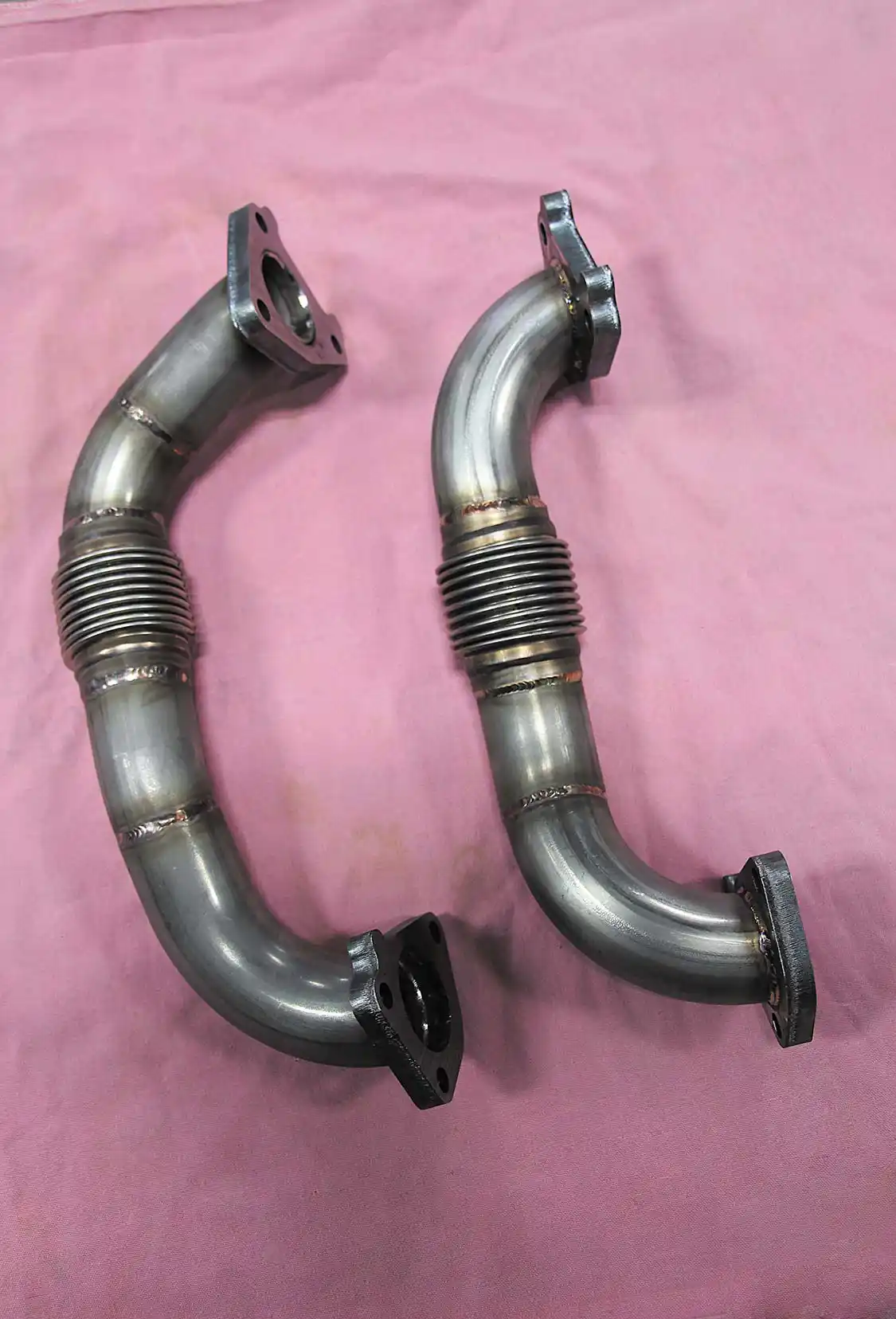 7. Prior to reinstalling the transmission, the guys at Randall’s bolted these high flow up-pipes to the factory exhaust manifolds. Made by <a href="https://www.wcfab.com/">Wehrli Custom Fabrication</a>, the symmetrical pipes measure 2-inches in diameter, feature smooth bends, and are made from 11-gauge stainless steel. The primary reason for upgrading to the 2-inch up-pipes is due to them having stronger bellows (the OE bellows can blow out) and the fact that they help decrease exhaust gas temps.