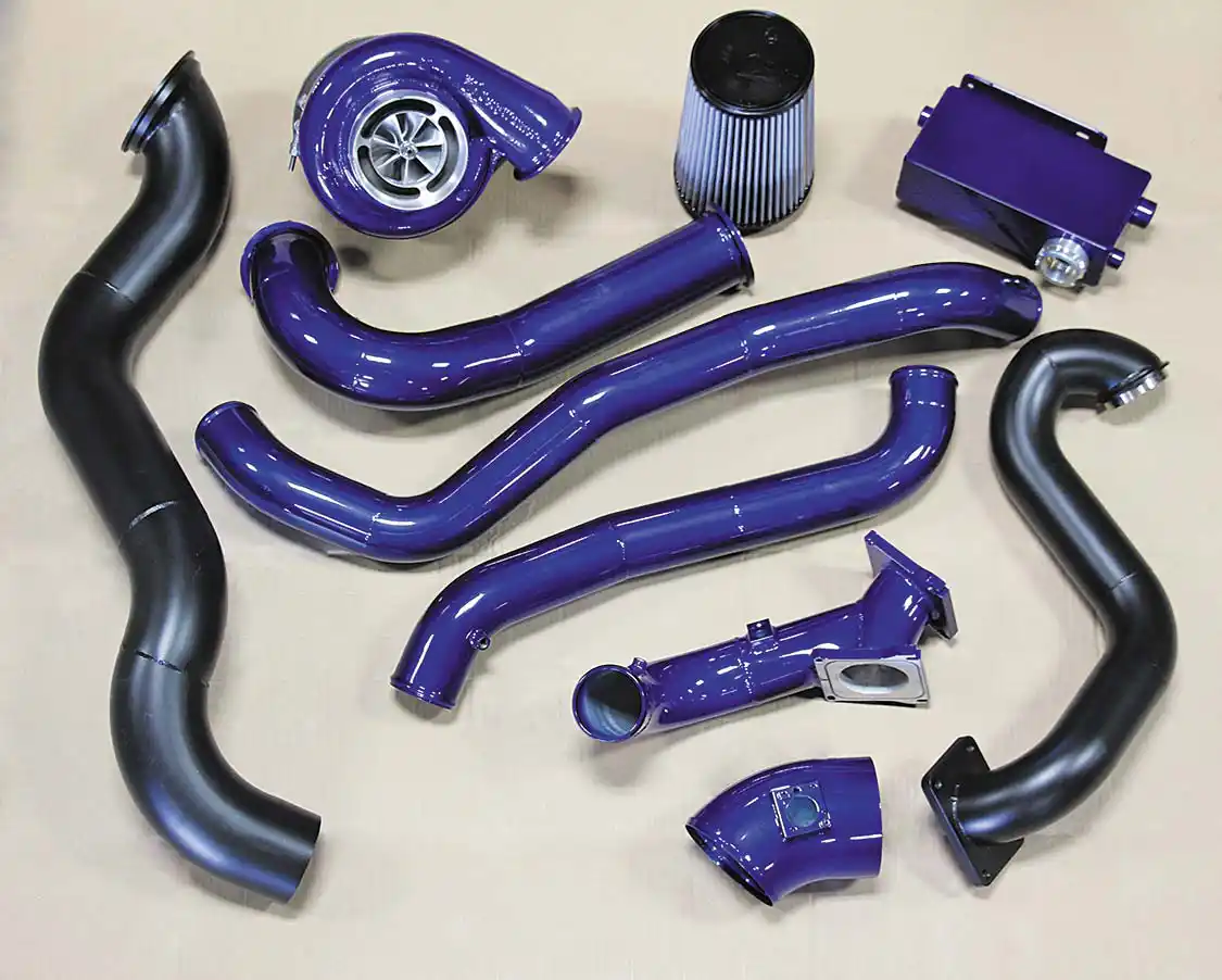 8. With a reputation for offering some of the best compound turbo kits in the industry, Wehrli Custom Fabrication’s S400 over stock twin-turbo system was the only choice for this build. Based on the ease of the installation process, the quality and craftsmanship of the parts included, and the overall performance gain, the techs at Randall’s Performance swear by these kits and install them religiously on 2001-2016 Duramax mills. To our knowledge, this is the only Duramax twin kit on the market with a one-piece cold side intercooler pipe between the turbos. This adds rigidity to the entire system and keeps the atmosphere turbo from bouncing (which can lead to broken piping, mounting brackets, or boost leaks). As standard equipment, both the downpipe and hot-pipe are coated in high-temperature black.