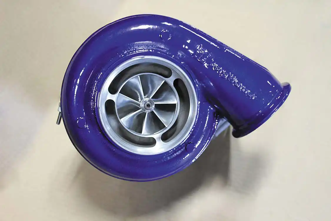 9. While a <a href="https://www.borgwarner.com/home">BorgWarner</a> S475 turbo (with a cast compressor wheel) comes standard on the Wehrli Custom Fabrication kits, this truck’s owner opted to upgrade to a billet wheeled 80mm version. Even though we’re not upgrading the stock <a href="https://www.garrettmotion.com/">Garrett</a> VVT turbo in the valley, this billet S480 will provide enough airflow up top to easily clear 700 hp. The key benefits of retaining the stock VVT turbo are: lightning quick spool up and great towing performance, not to mention that it keeps the overall cost of the twin kit down.