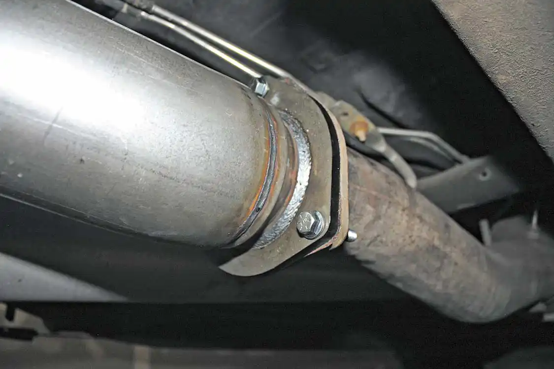 15. The installation of the AFE Power 5-inch exhaust kit couldn’t be any easier: The stock tail pipe section is unbolted at the OEM 3-bolt flange and removed from the factory hangers. The new kit will reuse the hangers and bolt right back up in place of the OEM pieces. The massive 5-inch pipes fit nicely over the axle and around the rear tire with no rubbing issues at all.