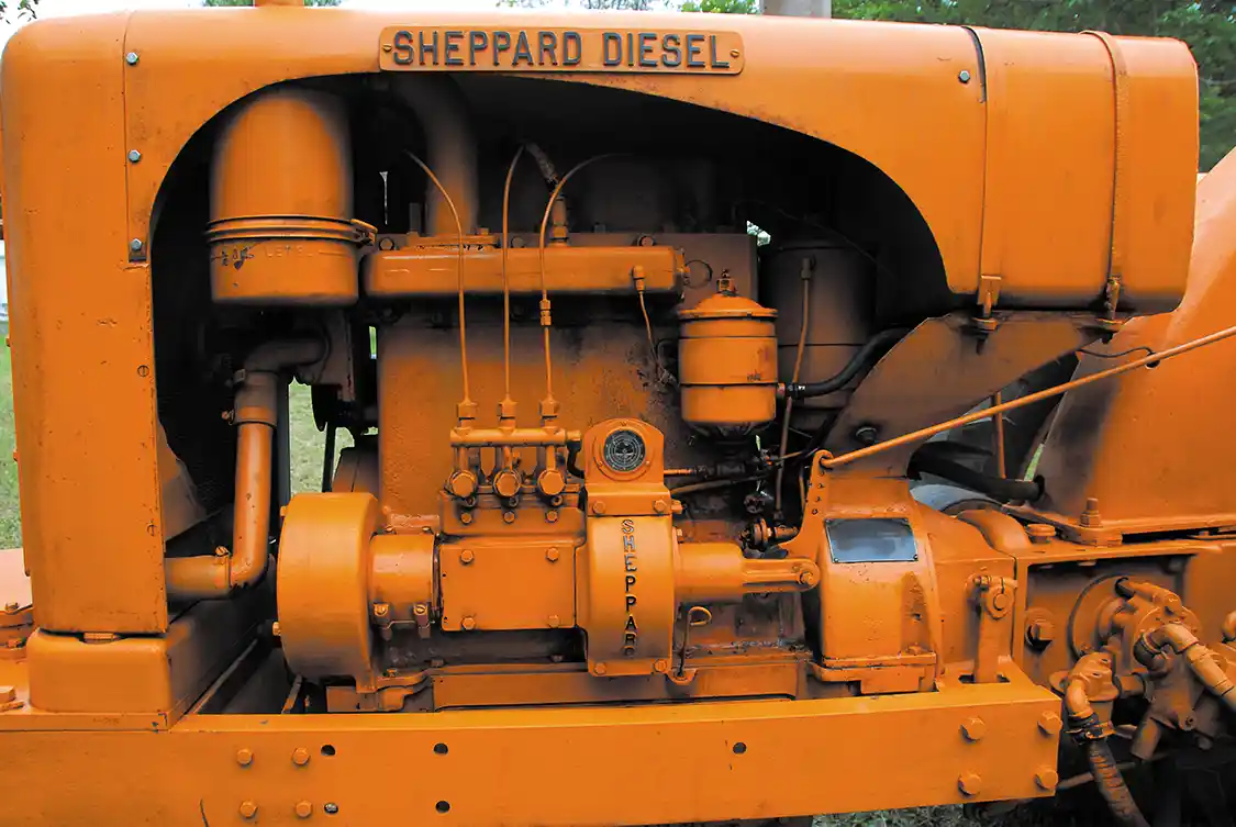 The Sheppard SD3's 6B engine was in indirect-injected three-cylinder with four main bearings, wet sleeves and a 22:1 compression ratio. It was a direct start and had a cold start aid in the form of an electric coil onto which was sprayed diesel fuel. The system didn't work very well and was most often disabled because it tended to allow air into the injection system. At 1,660 lbs, the engine is massive for its small 188 ci displacement. The 6E engine was optional and had a quarter-inch more bore. Version of these engines were offered for industrial use, marine applications or generators.