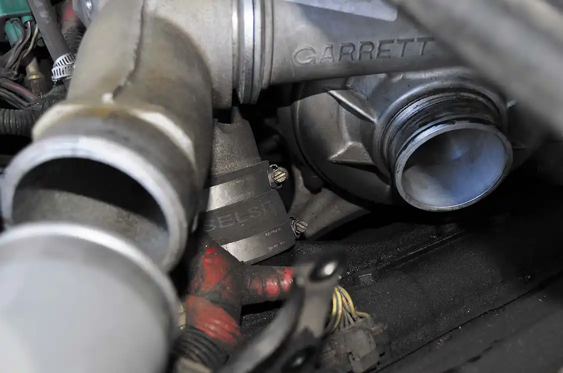 14. The intake spyder feeds the heads through two boots going to each intake runner. Loosening both clamps on each boot allowed for easy removal of the intake spyder.