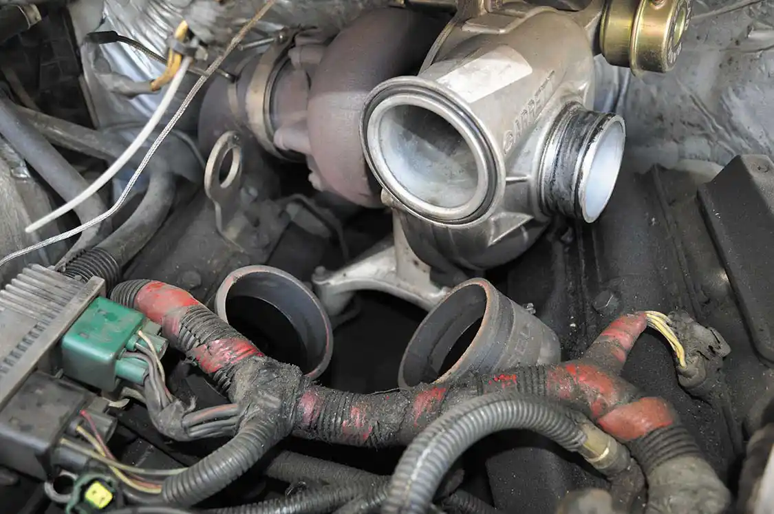 16. With the intake out we now had two open intake ports. We crammed a few clean rags in their openings to make sure no foreign objects would make it into the valves and ultimately the combustion chamber, wreaking havoc.