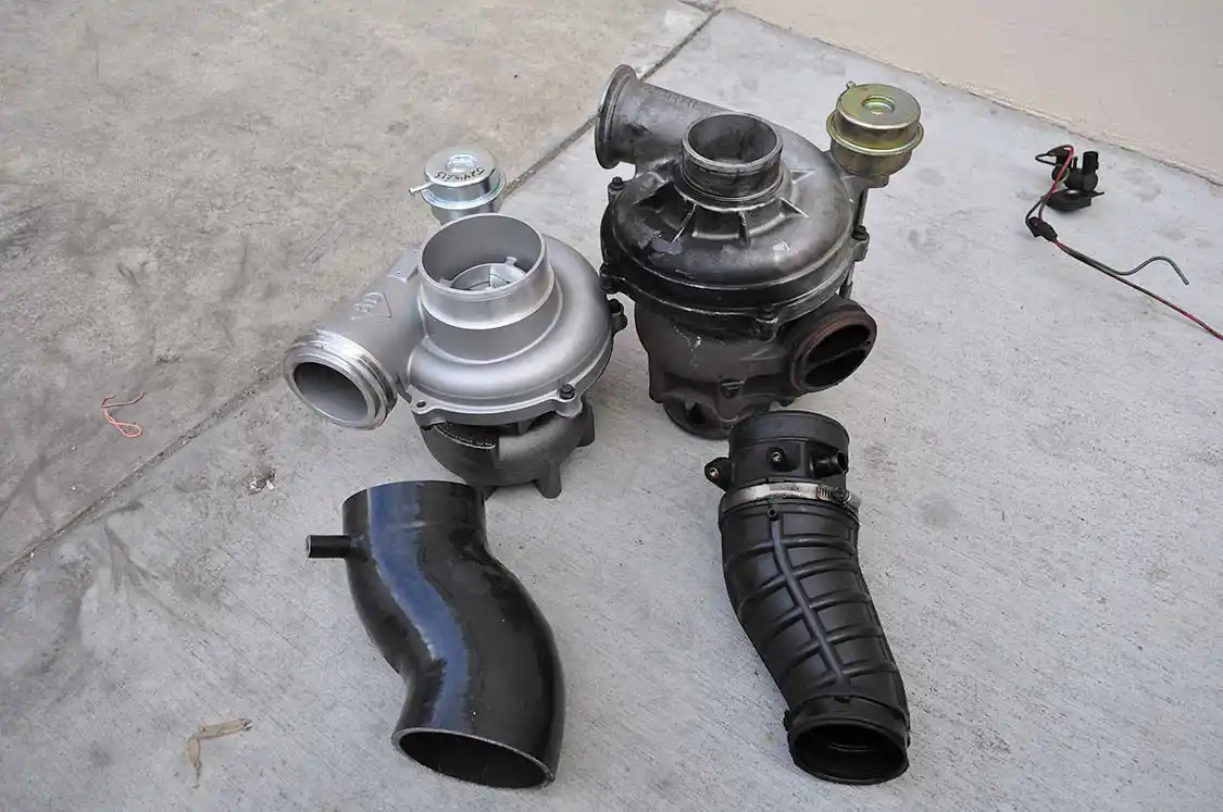 19. Overall size-wise, the two turbos aren’t that different looking. The obvious difference being the massive air intake on the BD Turbo Thruster II versus the tiny stock opening that’s nearly half the size.