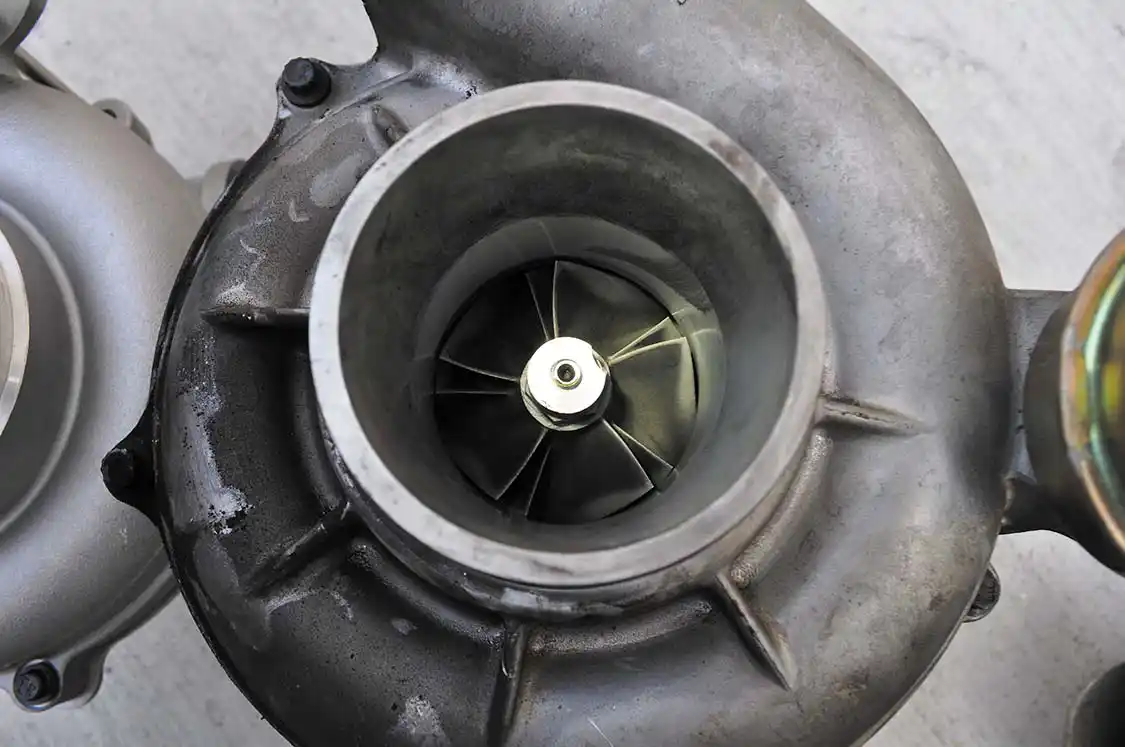20. The stock GT38 turbocharger with upgraded compressor wheel. Once out we noticed roughly a quarter-inch of play in the turbo’s center rotating assembly. There was so much play the compressor wheel was actually hitting the housing. If left in the vehicle much longer this turbo would have soon sent shrapnel into the engine causing catastrophic failure.
