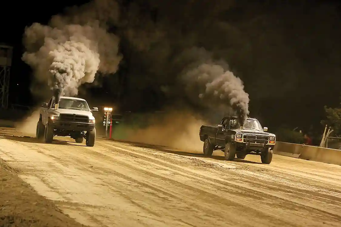 The dirt drags ran late into the night and made for a great show for the crowd. These two big Cummins trucks may not be completely street legal thanks to those awesome hood stacks, but that won’t keep them from having some fun off-road.