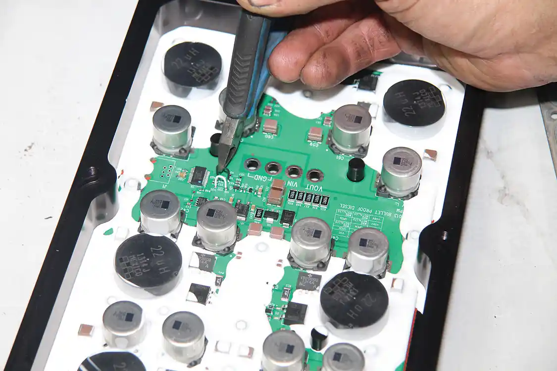 9. Bullet Proof’s six-phase FICM boards come set at the standard 48 volts, same as the four-phase and OEM units. However, the six-phase boards can be set to output either 53 or 58 volts. Higher voltage is said to offer better performance, but the 58-volt setting can set soft codes. This FICM is being modified to the 53-volt setting.