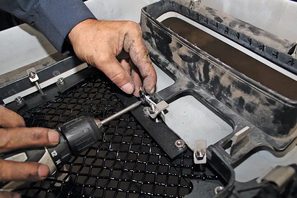13. In addition to the tabs, the insert attaches to the factory shell using screws and metal tabs that are supplied with the kit. The Royalty Core insert is surprisingly heavy, and using all of the available attachment hardware helps ensure that it stays secure.