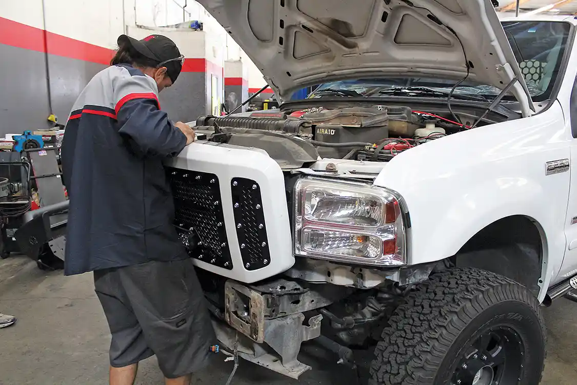 16. Once assembly is complete, reinstalling the grille assembly is a simple matter. The grille can be installed with the factory bumper in place, but removing it will make the job much easier. If you have an aftermarket bumper, removal will most likely be mandatory.