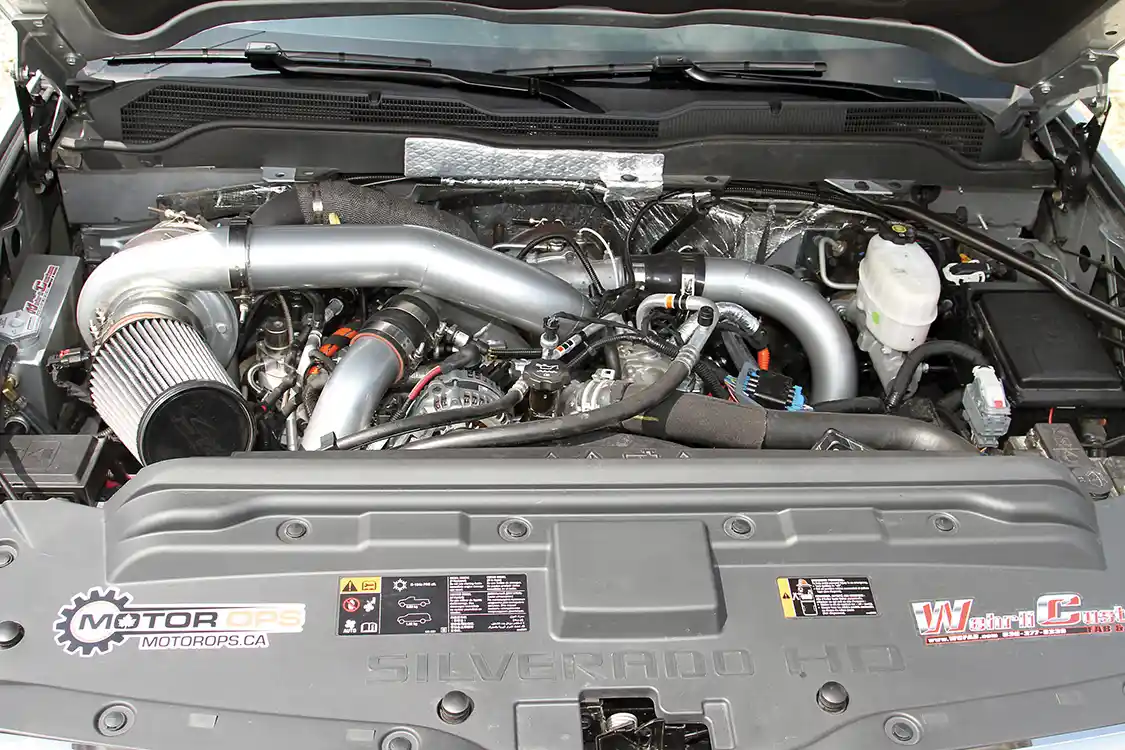 Popping the hood on Brian Randall’s 2015 Chevy reveals more than just your standard LML Duramax engine.