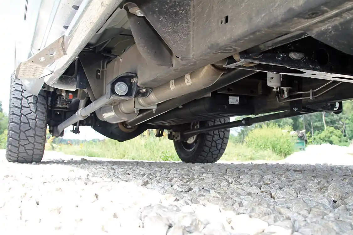 A set of <a href="https://www.ouostore.com/">One Up Offroad</a> traction bars links the frame to the axle. Check out the 4-inch diameter Flow Pro stainless steel exhaust system and the custom one-piece steel driveshaft.