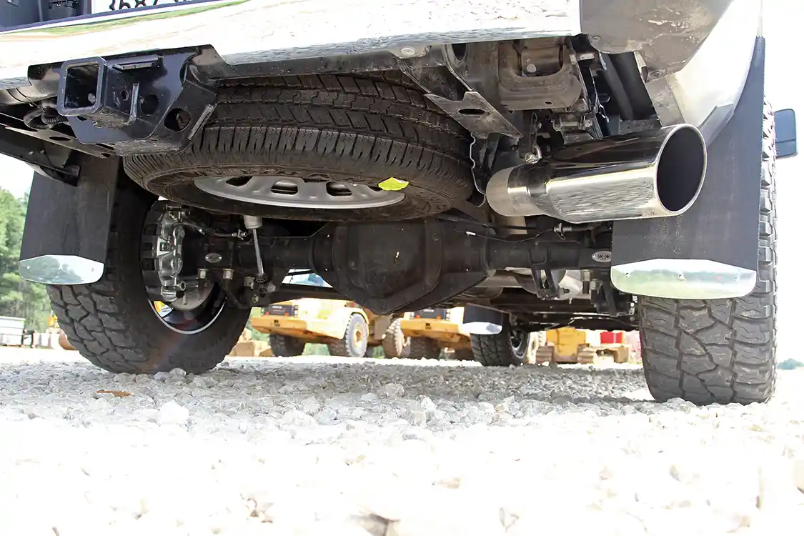 A look under the rear of the truck shows the polished stainless steel exhaust tip as well as the Fox Racing Shox and Luverne textured mudflaps.