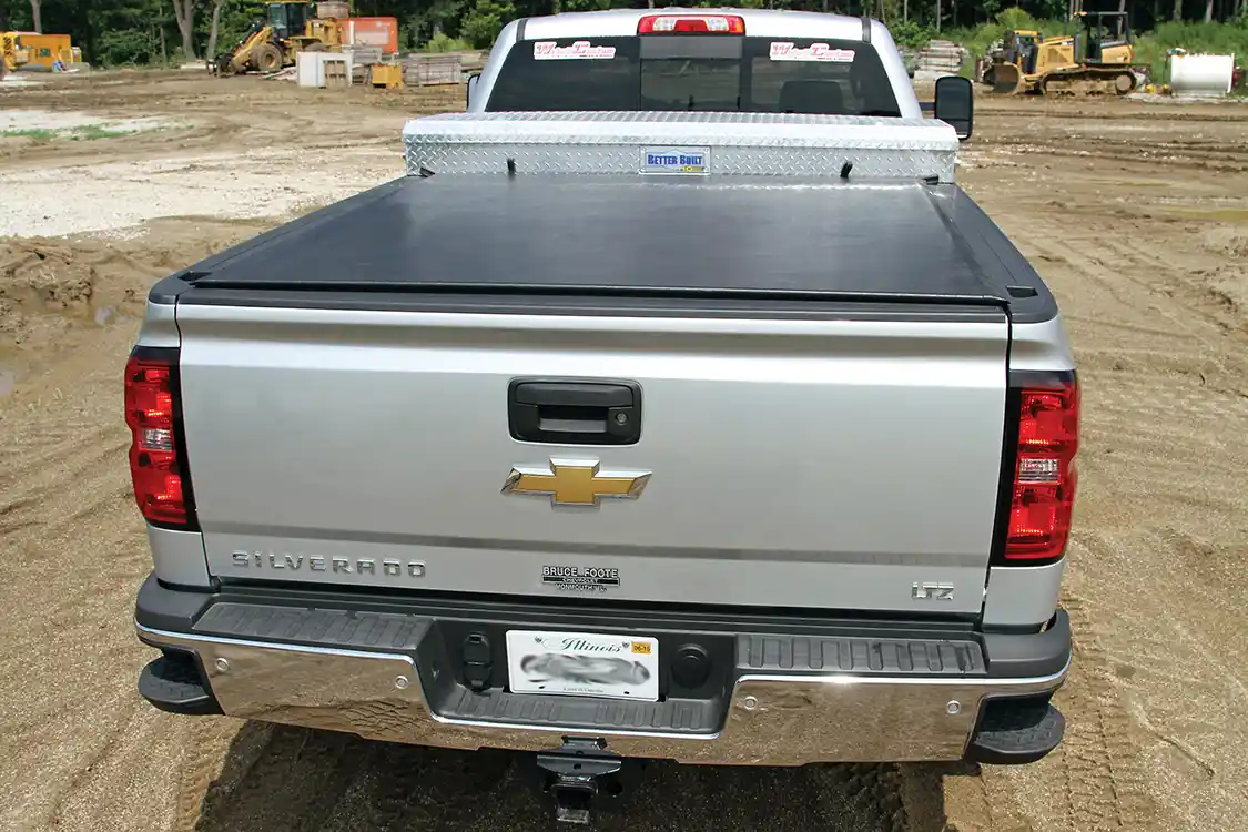 Randall installed a Better Built diamond plate aluminum toolbox for storage and a Truxedo Lo-Pro bed cover to protect the contents of the bed. The bed cover opens easily to provide access to the B&amp;W gooseneck hitch.