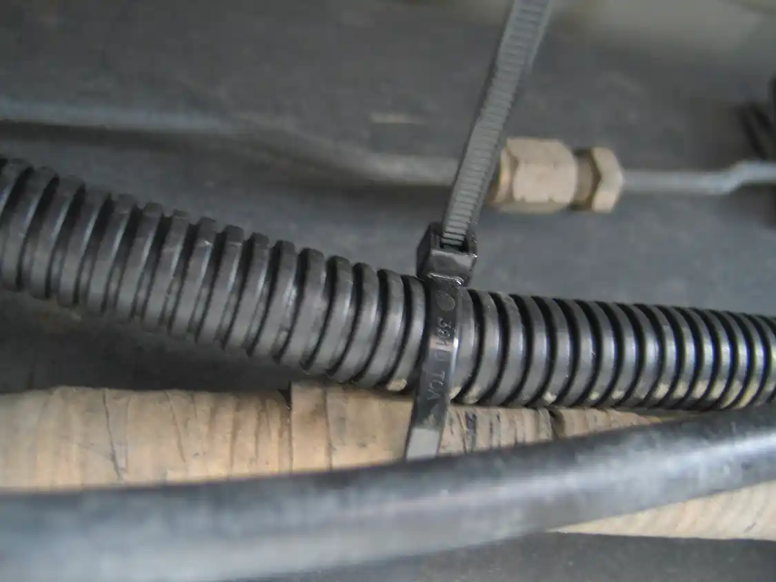 11. There are plenty of places along the frame to secure the wiring harness, and Bestop includes plenty of cable ties for this purpose. There’s a group of four "trigger wires" that will need to be routed into the cab through any of the rubber grommets in the body shell.