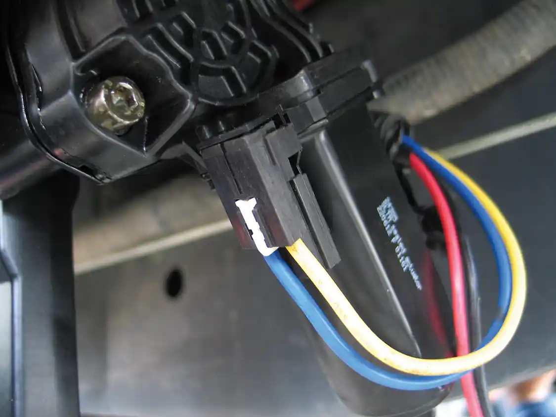 12. Each motor unit has four wires. The yellow and blue wires activate the motors, while the red and black wires power the courtesy lights attached to each linkage arm.