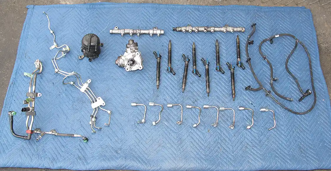 12. Here you see the entirety of the engine-mounted fuel system from our 6.7L Power Stroke. All of the injectors are being replaced, along with the high-pressure pump, filter and all fuel lines.