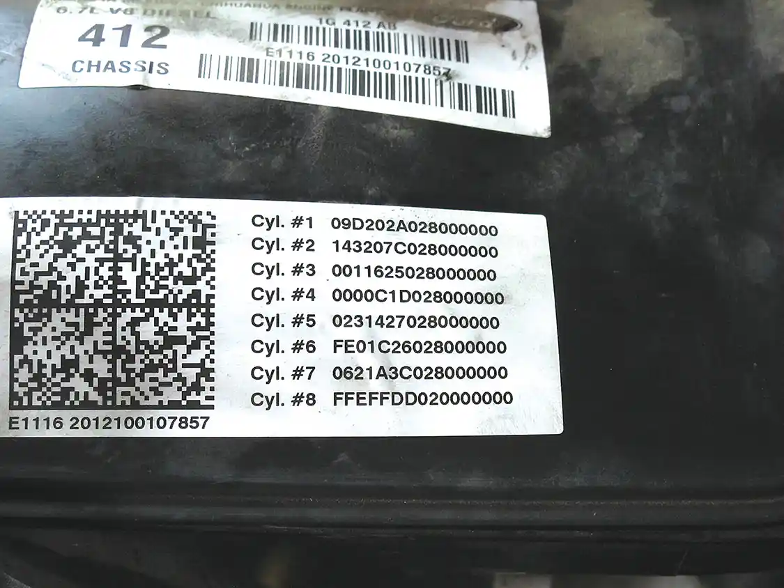15B. Each individual injector on the 6.7L Ford Power Stroke has its own ID code. When the trucks roll out of the factory, these numbers are printed on the valve cover. Each new injector must have its code entered into the engine ECU.