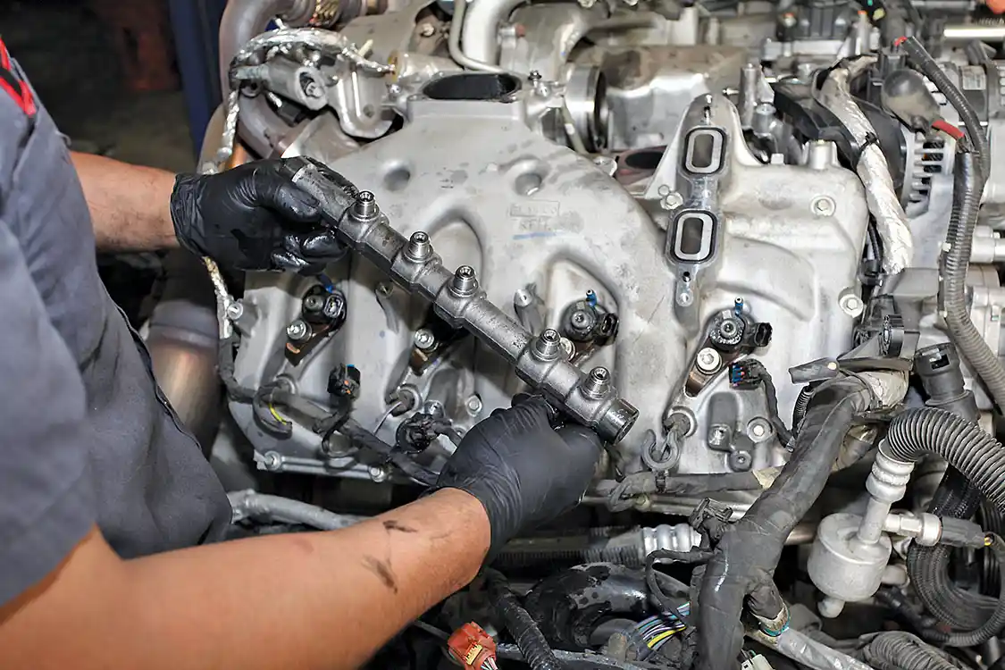 7. The aluminum fuel rails on both sides must be discarded. If recycled, they may come back as a new F-150 body part.