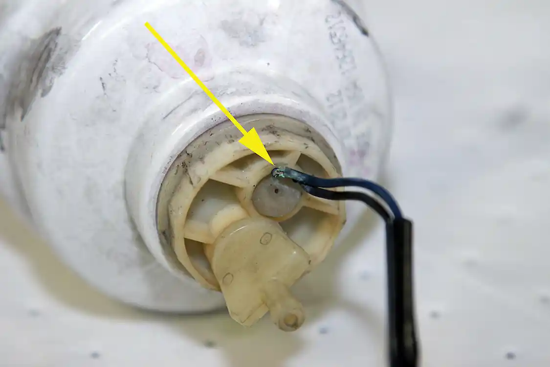 8. Looking at the water-in-fuel sensor harness, it was obvious that it was ready to fail (see arrow). In fact, when positioning the harness for our photos, the corroded lead actually broke away from the sensor.