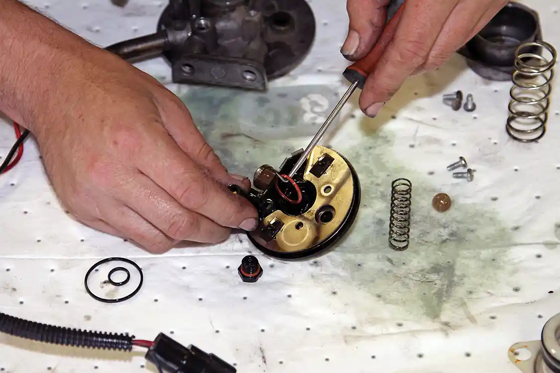 15. Using a pick tool, Phaff removes the old O-rings from the fuel heater, filter head and primer assembly. If you don’t have a pick tool, you can use a toothpick or other similar pointy object.