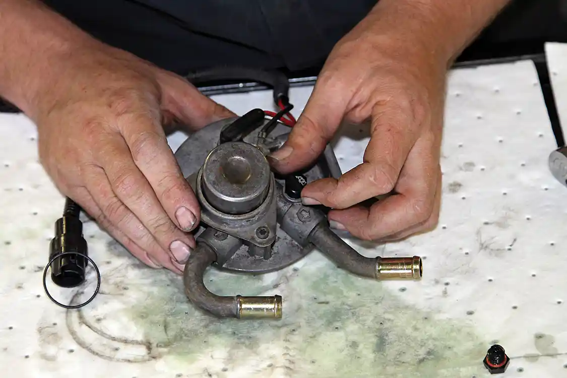 20. Phaff replaced the flimsy plastic fuel bleeder with the new billet aluminum bleeder included in the Master Kit.