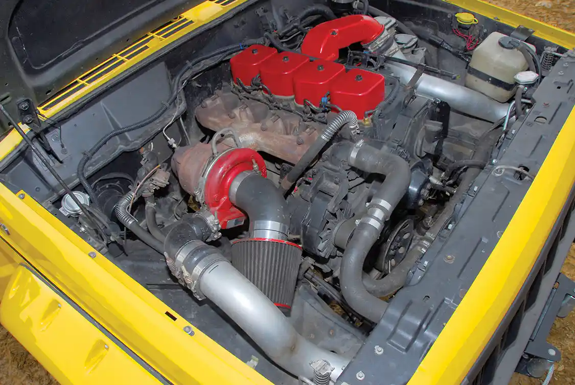 If you didn’t know any better, you’d think this was a factory fit. The radiator sits in its original position, but the converted <a href="https://www.powerstrokediesel.com/">Power Stroke</a> intercooler required moving the headlight buckets forward a couple of inches. The conversion included adding a Hydroboost brake booster from a <a href="https://www.chevrolet.com/">Chevy</a> Astro van.