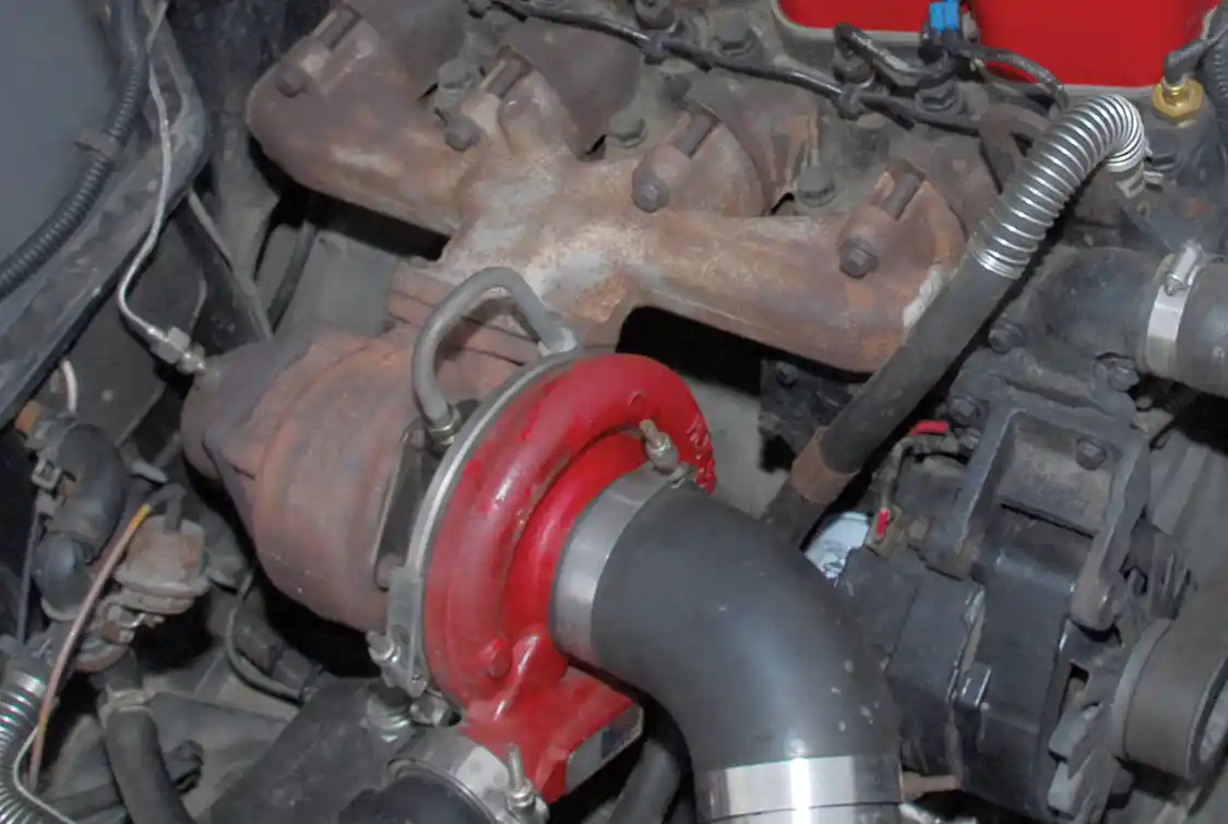 The original 4BTA exhaust manifold wasn’t going to work because it placed the turbo at the very back of the engine. The fix was fairly easy because the exhaust ports of the 4BTA have the same spacing as the 6BT. Owner Donald Bankston cut the #1 and #6 cylinder branches off a 5.9L Cummins manifold and welded up the holes using nickel rod.