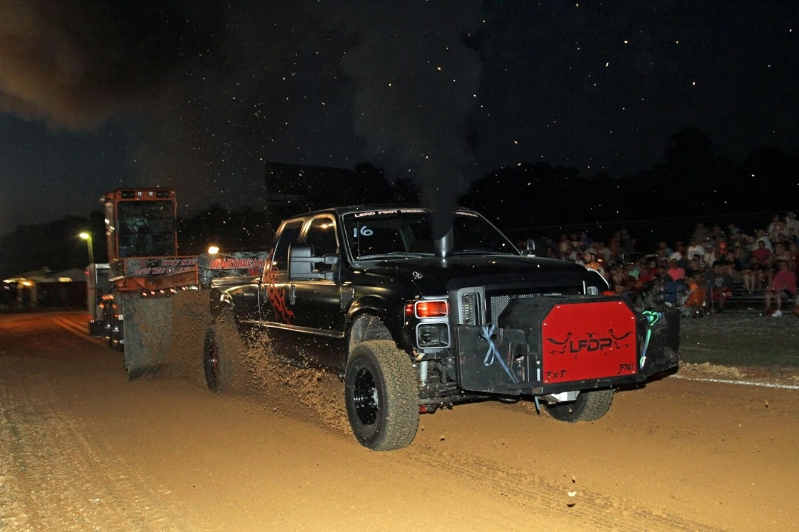 Jonathan Brooklyn’s sinister-looking 2008 Ford blasted down the track with the sled in tow for over 330 feet at nearly 30 mph, taking the win in the Run-What-Ya-Brung class.
