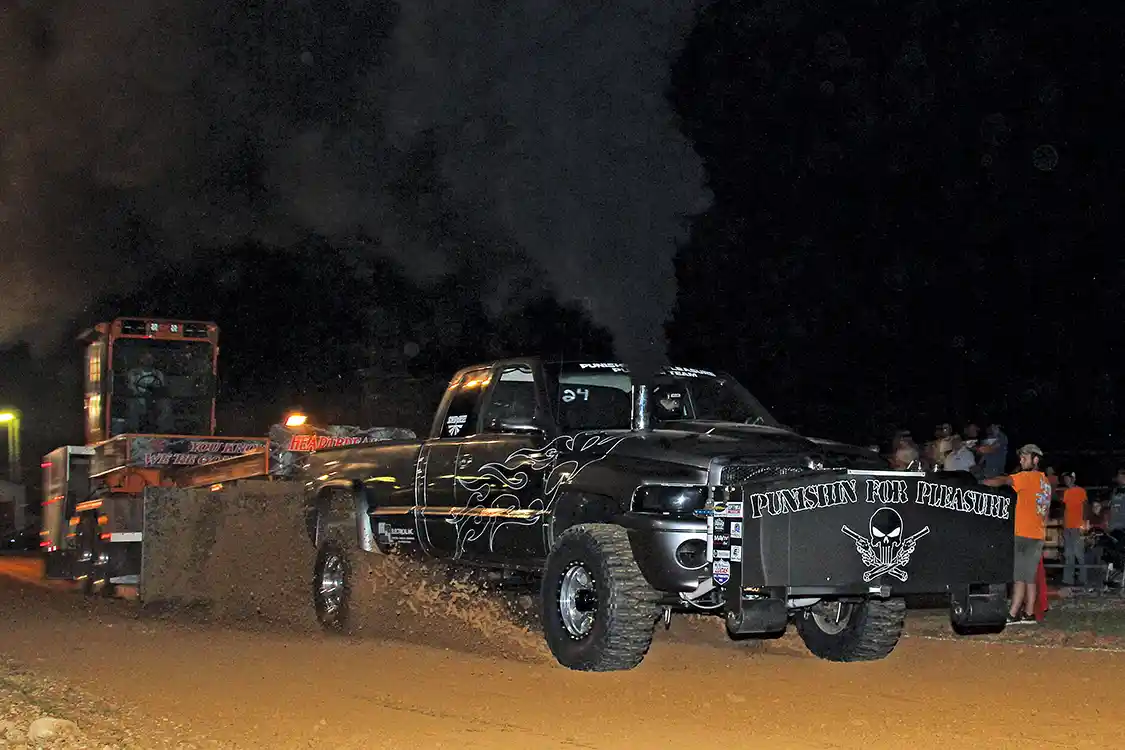 Josh Mosley’s 1999 Dodge named “Punishin’ For Pleasure” looked great as he churned through the dirt dragging the sled 324 feet, winning the 3.0 class by less than a foot.