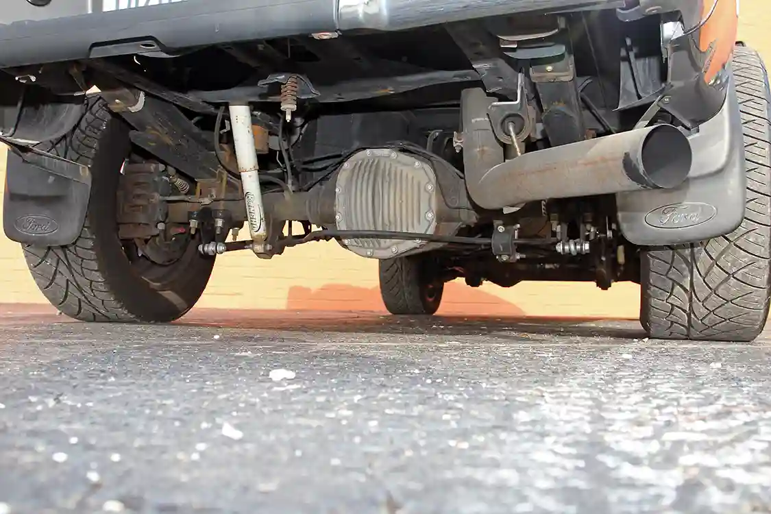 The view from the rear shows the factory Sterling 10.5-inch differential, <a href="https://www.gorancho.com/">Rancho</a> FX4 shocks, and Flo~Pro 4-inch stainless steel exhaust system.