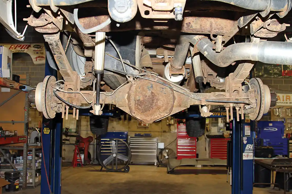 2. With more than 360,000 miles on the clock it’s no wonder that the underside of the truck has a little surface rust—we were worried that the diff cover might actually rust through! Notice how the rear axle tubes are larger at the differential housing than the rest of the tube and how the U-bolts and shock mounts hang down below the rear axle housing just waiting to get hung up when off-road.