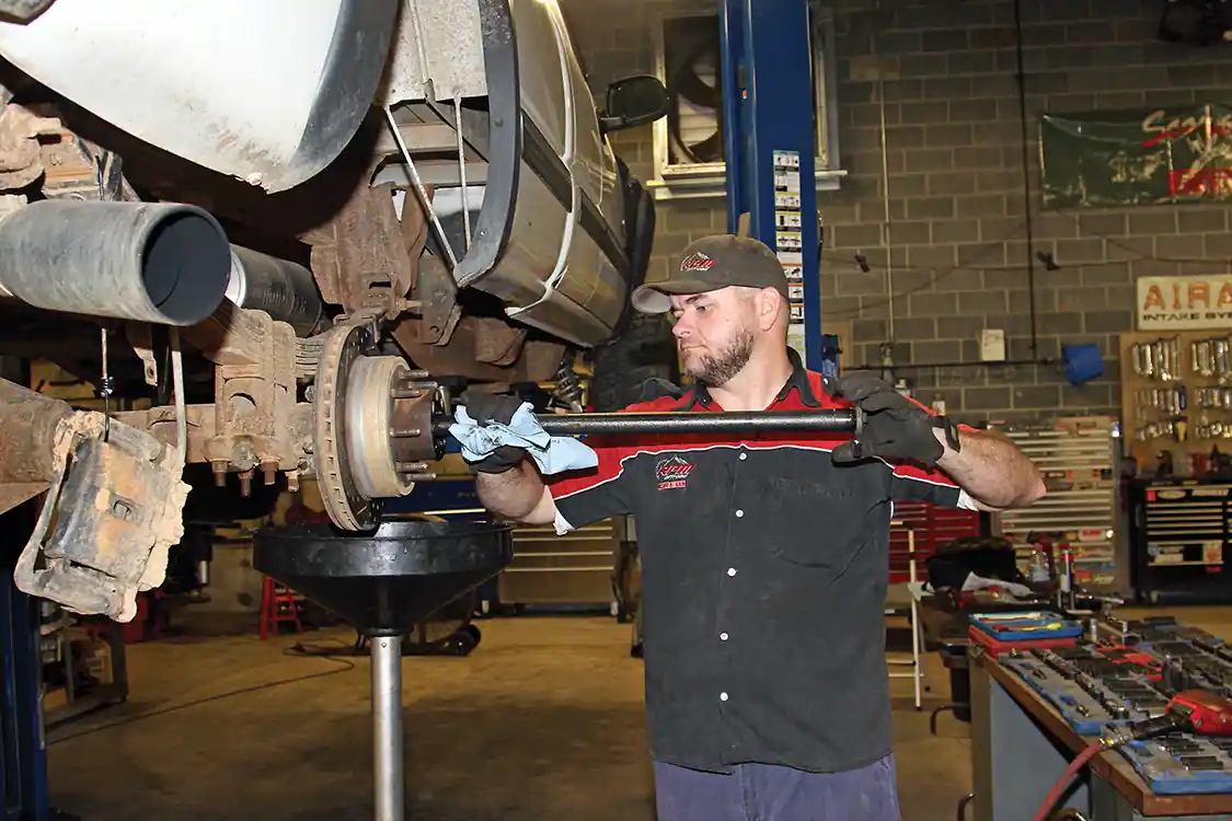 6. After removing the axle bolts the factory 30-spline axles can be removed from the housing.