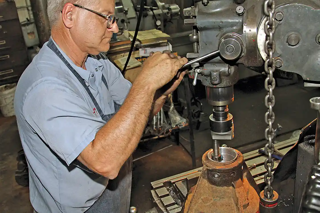 14. The factory axle tubes are pressed into the housing and secured with hardened plugs that were very difficult to try to drill out so we took the housing to Twin City Auto Machine where Jack Sorah used a mill to bore out the complete axle tube.