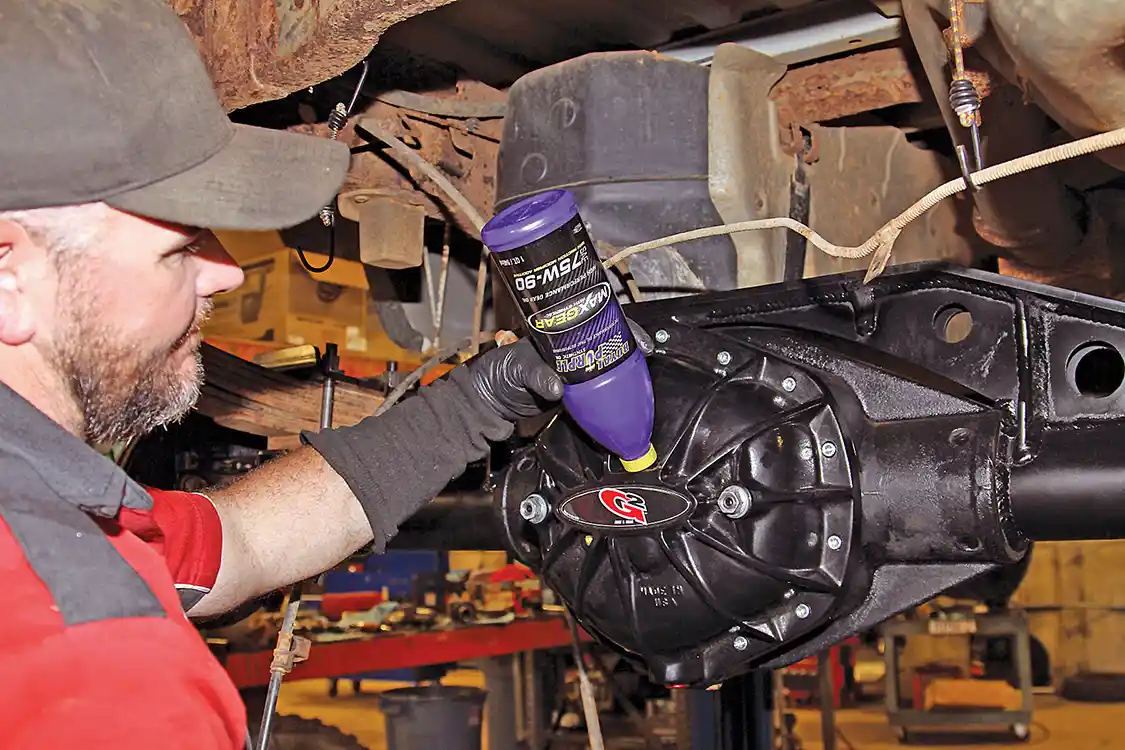 29. We decided to take it a step further and installed the G2 Torque diff cover with load bolts to help keep the carrier from trying to walk out the back of the housing under load. After Nelson installed the cover he filled the axle with Royal Purple MaxGear 75W90 gear oil to make sure everything is well lubricated.