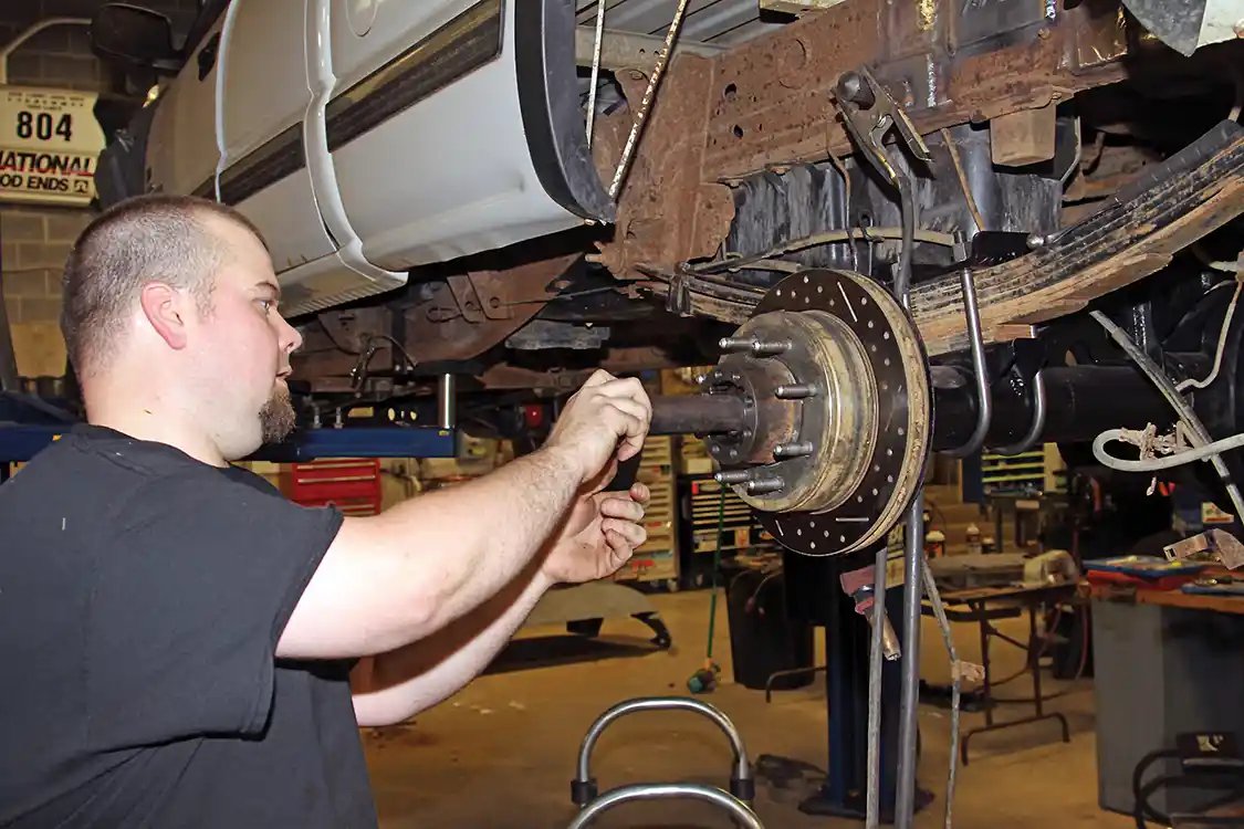 30. Jereme Miltier installed the Branik Motorsport axles in the housing then installed the 40-spline drive plates that connects the axle to the hub and spins the wheels.