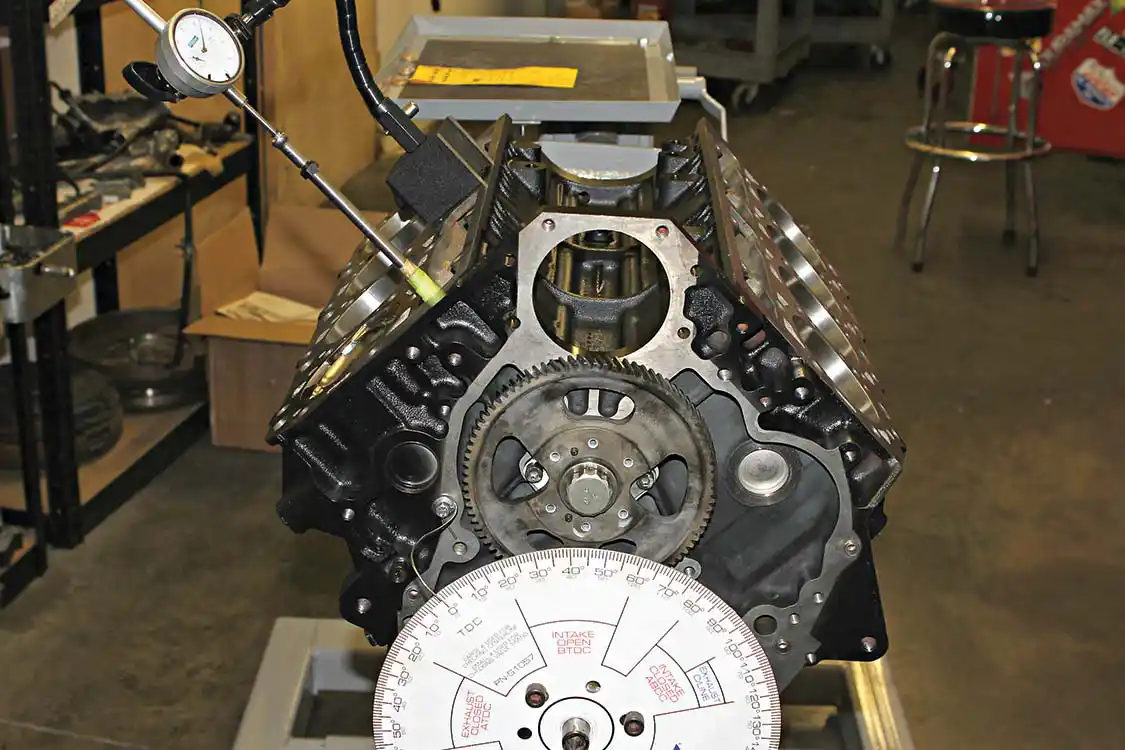 12. The engine's crankshaft is then rotated clockwise one last time until the dial indicator reads 0.050. The reading seen on the degree wheel at the pointer at this location is the lift on the camshaft with the intake lobe opening. You can now compare this reading to what is found on the cam card supplied with the camshaft. If the numbers match, the camshaft is set correctly and you can move on with the build. If the numbers are not the same, an offset timing key or changes with the timing gear will need to be made. Factory specs allow for a +/-1 degree tolerance due to gear lash and wear on the teeth.