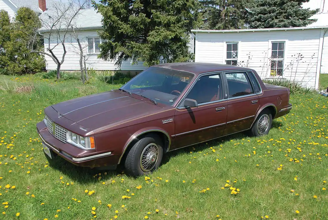 The Dark Maple Red Metallic paint may be fading but you can still see the lovely lines that made the Cutlass Ciera Oldsmobile’s best selling car for 14 years. This one was built in March of 1983 and sold to the Verhoff family by Jack Howell Chevrolet-Oldsmobile in Ottawa, Ohio, for the princely sum of $10,818. Base price for the LS Sedan was $8,892. Add to that the 4.3L diesel ($500), four-season air conditioning ($725), body side moldings ($55), accent stripe ($42), rocker panel moldings ($56), 14-inch radial tire upgrade ($36.60) and block heater ($42). There was a credit of $56 for a radio delete.