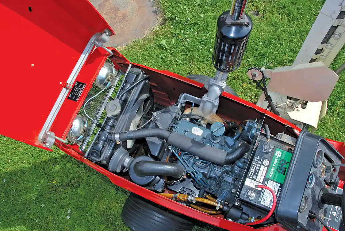 It’s small, but it's a real diesel! The water cooled Kubota D-600B is a tiny three-cylinder natural-aspirated indirect-injected engine that can make up to 15 intermittent horsepower at 3,600 rpm. It displaces almost 37 cubic inches and uses a <a href="https://www.bosch.us/">Bosch</a> MD mini-pump with Bosch throttle type injectors that open at 1,991 psi. The pump is fed at 7 psi from a 4-gallon tank via an electric pump. The crankshaft is supported by four main bearings and the cylinders are dry sleeved in the iron block. The engine assembly, including the radiator and fan, weighs 136 lbs. The only downside to the installation is that the lawn and garden-sized battery may not always be up to spinning the 23:1 CR diesel in cold weather; a block heater was optional and probably necessary when using the 782D for winter work.