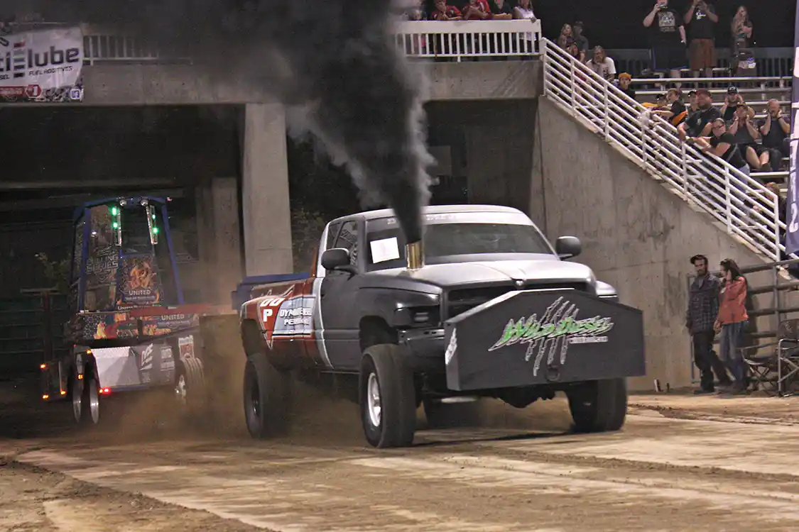 Trevor Larkin, a mechanic for nearby Wild Diesel, runs this big dually 12V Cummins in the 3.0 Inducer class. His 272.28-foot pull snagged third place, just 4 feet shy of the winner.