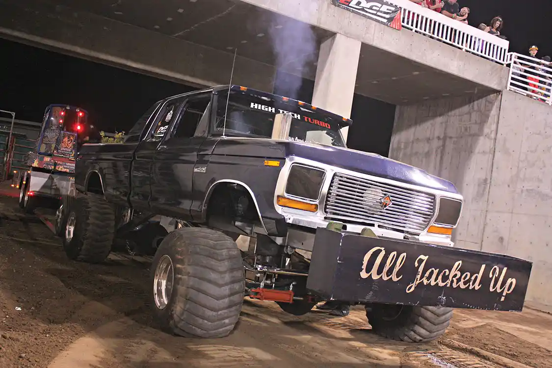 This old <a href="https://www.ford.com/">Ford</a> Highboy owned by Russ Prescott competes in the Pro Mod Diesel class and runs an International DT466 motor with a big 91mm single turbo. In a class dominated by <a href="https://www.dodge.com/">Dodge</a> Cummins trucks, it’s nice to see there are still a few Blue Oval fans willing to push the envelope on a dirt track.
