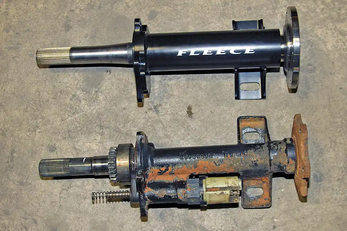 7. Compare the multi-piece factory axle assembly to the single-piece TufShaft from Fleece Performance Engineering. We installed one of the early TufShaft kits, which included a replacement housing for the axle. Their current design retains the stock housing but uses a single-piece shaft.