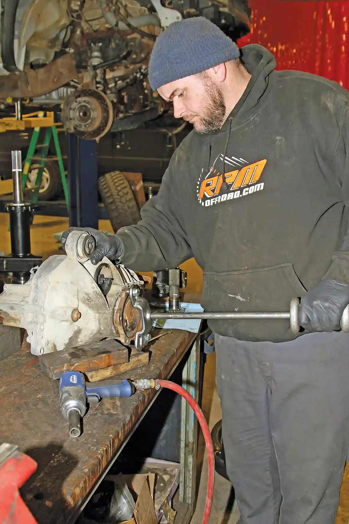 8. Normally a slide hammer is all that’s needed to remove the driver-side axle from the housing, but the retaining clip on ours was seized and it wouldn’t budge.