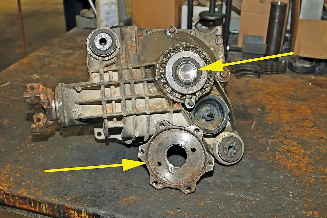 9. We had to have the crew at <a href="https://www.facebook.com/Twin-City-Auto-Machine-103866934589677/">Twin City Auto Machine</a> mill the flange off the axle shaft (see arrows) so that the case could be split with the axle shaft stuck in the differential.