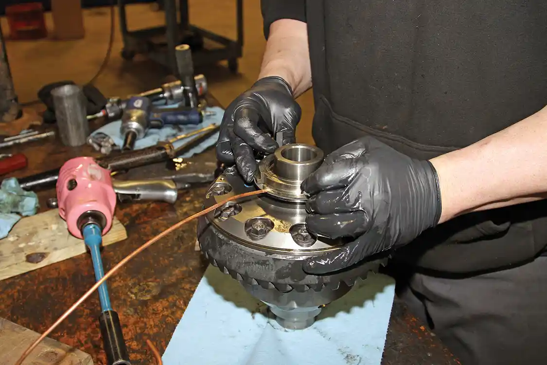 14. The seal housing is installed on the Air Locker before the new bearings are pressed onto the differential.