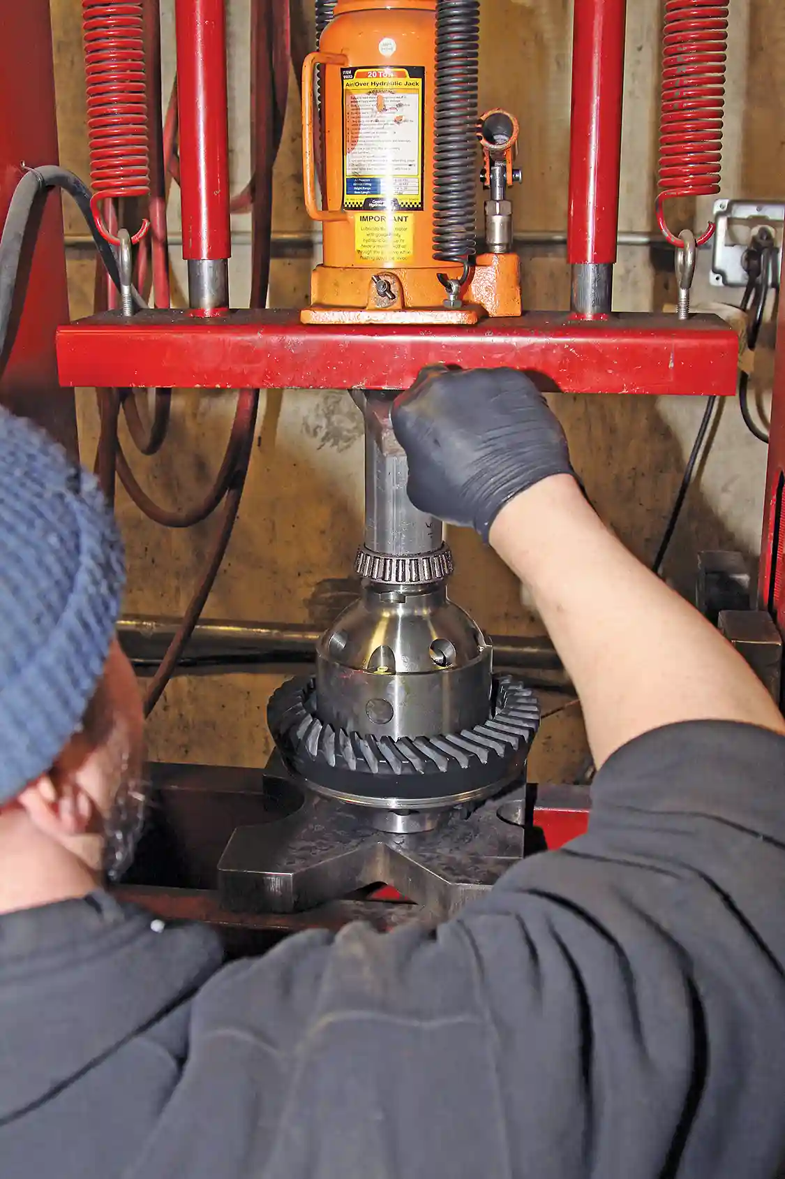 16. Nelson then uses a hydraulic press to install the new G2 bearings and the pinion gear on the locker. Important: If you do not have a press, DO NOT try to hammer on the bearings! Take the parts to a shop with a press and have them do it for you.
