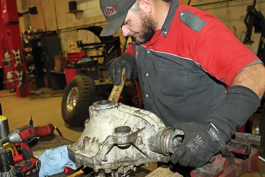 19. Nelson carefully sets up the gear lash on the housing, making fine adjustments and verifying the wear pattern on the gears with the gear paint G2 included with the rebuild kit.