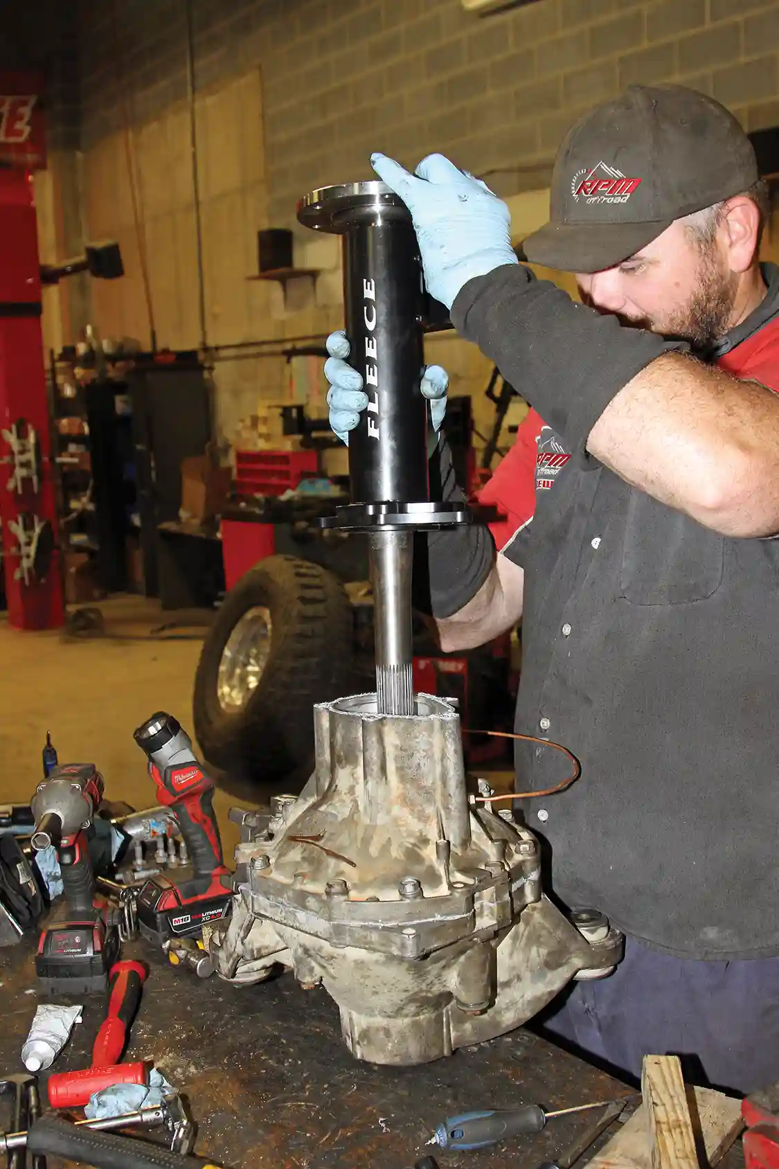 21. The passenger-side Fleece TufShaft assembly is the next thing to go together. With the newer design you would reinstall the factory assembly without the internals and slide the shaft into position from the end.