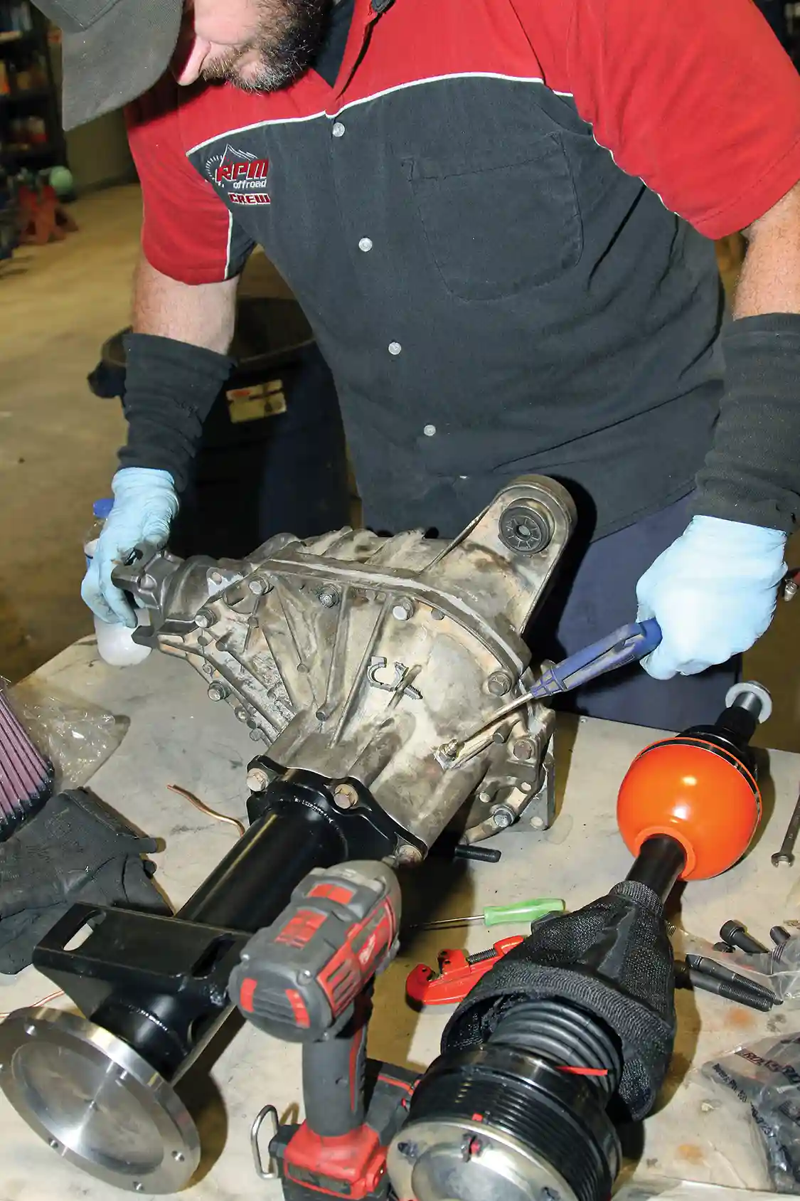 23. Then Nelson uses the shop air supply to do a final test on the ARB Air Locker to make sure that it engages and has no air leaks.