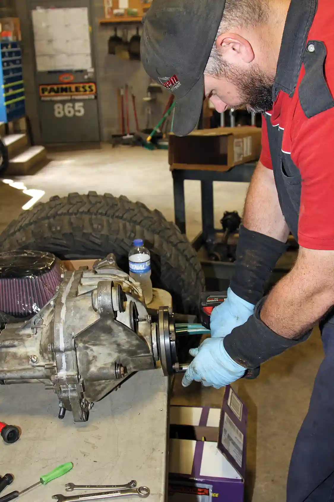 24. Before installing the housing back in the truck, Nelson installs the RCV Pro4 CV joint adaptors on the axle flanges using the factory bolts with Red T-71 WRP thread locker.